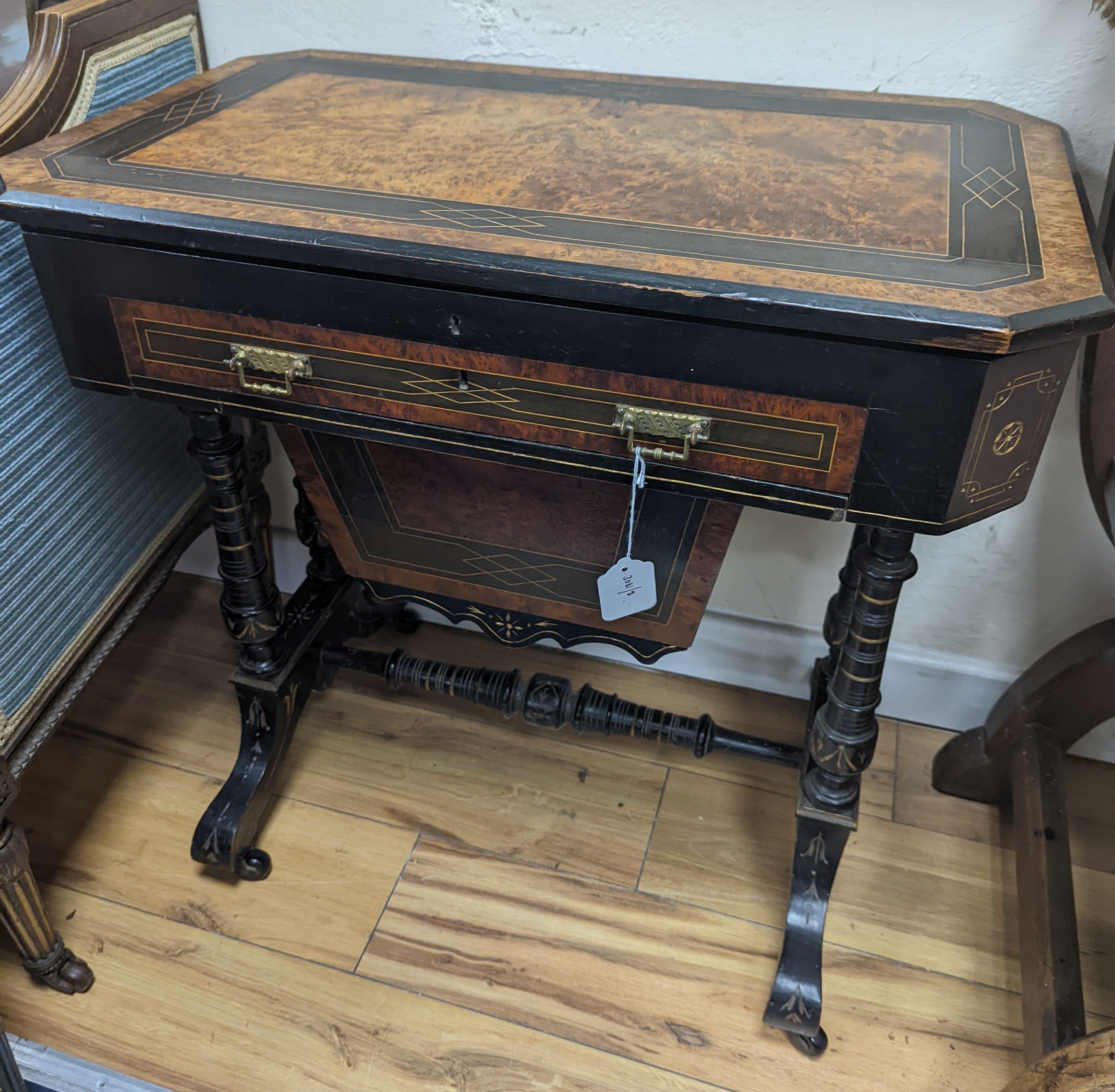 A late Victorian part ebonised bird's eye maple writing/work table, width 67cm, depth 41cm, height 69cm